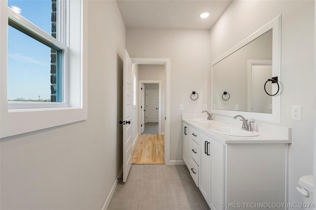 bathroom with tile patterned floors and vanity