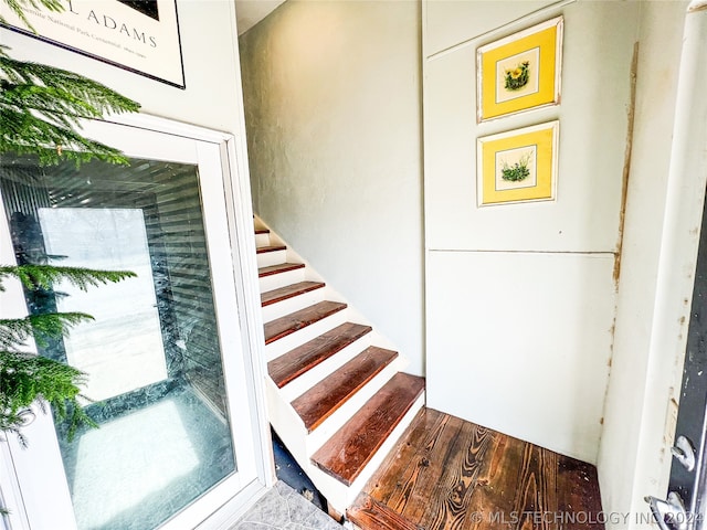 staircase with light wood-type flooring