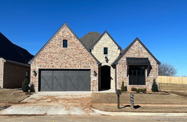 view of front of property with a garage