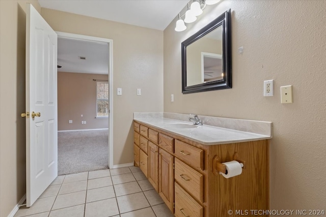 bathroom with tile flooring and vanity