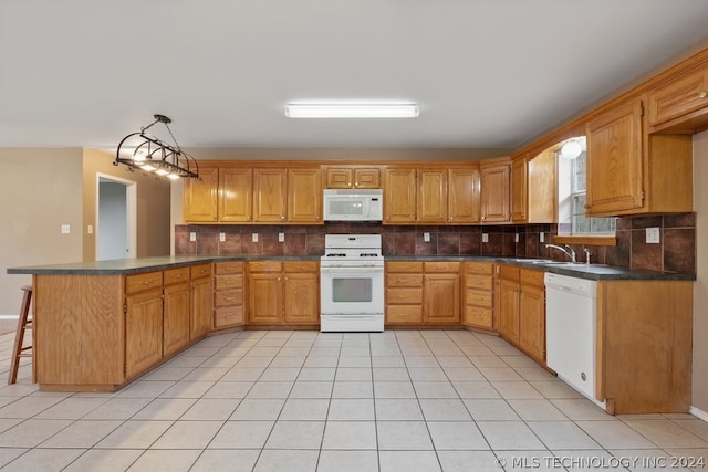 kitchen with backsplash, sink, white appliances, and light tile floors