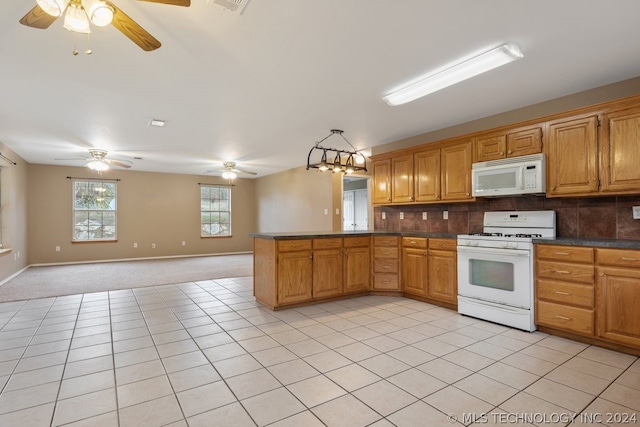 kitchen featuring ceiling fan, light tile flooring, white appliances, and backsplash