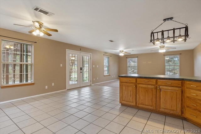 kitchen with french doors, light tile flooring, and ceiling fan