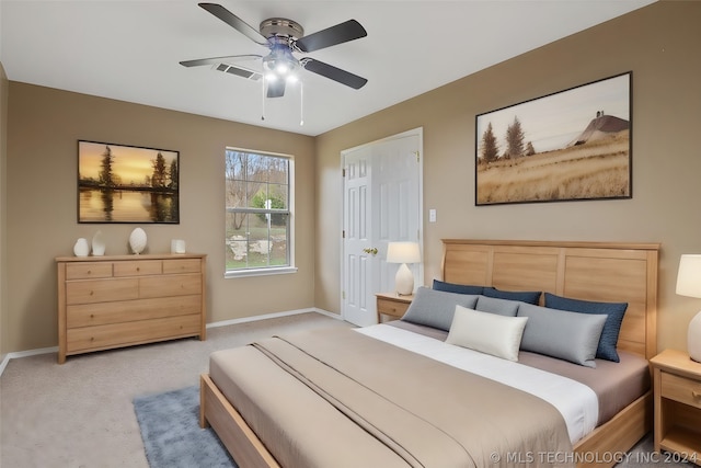 bedroom with light carpet and ceiling fan