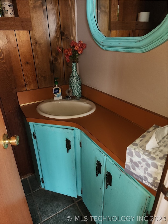 bathroom with tile floors and large vanity