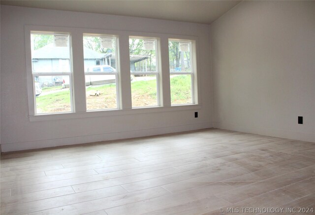 unfurnished room with light hardwood / wood-style floors