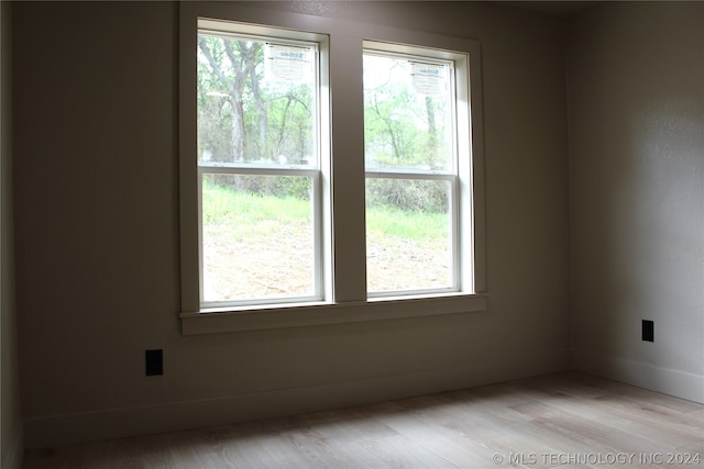 unfurnished room featuring light wood-type flooring