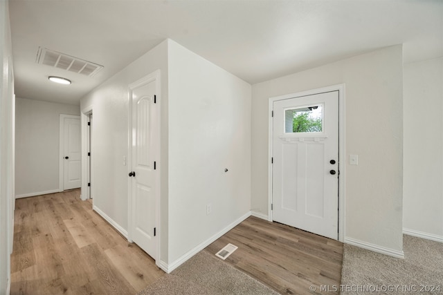 entryway with light hardwood / wood-style flooring