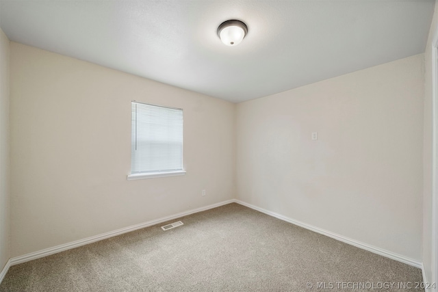 unfurnished room with carpet floors