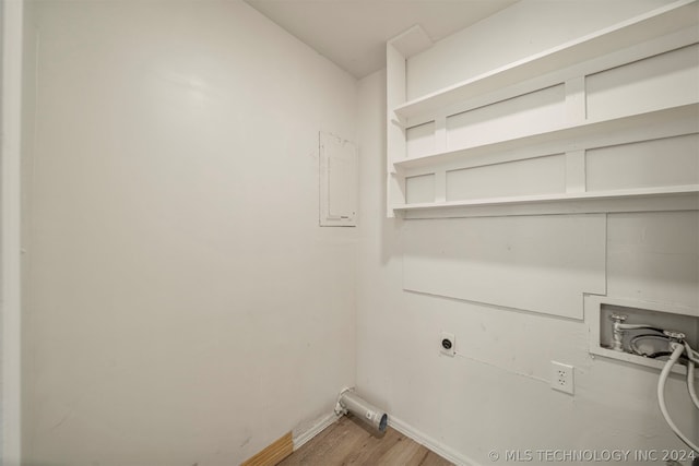 washroom featuring hookup for an electric dryer, light hardwood / wood-style flooring, and hookup for a washing machine