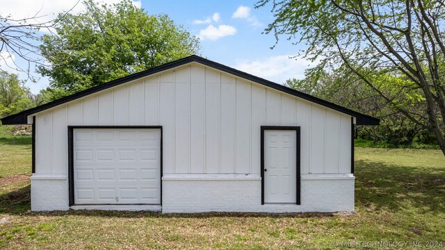 garage with a yard