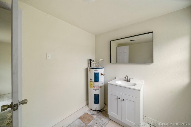 bathroom featuring water heater, vanity, and tile floors