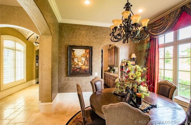 dining area featuring an inviting chandelier, a wealth of natural light, and light tile floors