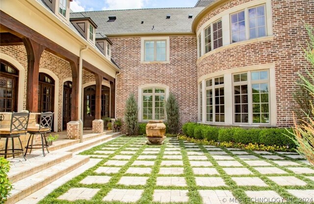 rear view of property featuring a patio