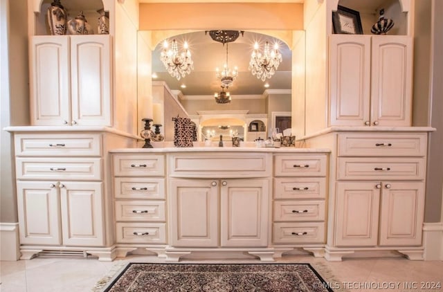 bathroom featuring an inviting chandelier, tile floors, and vanity