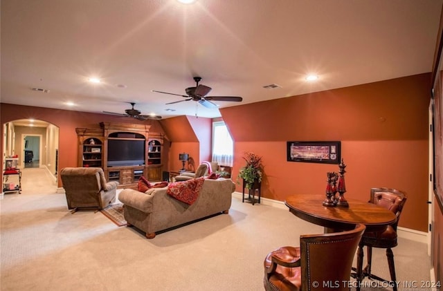 living room with ceiling fan and light colored carpet