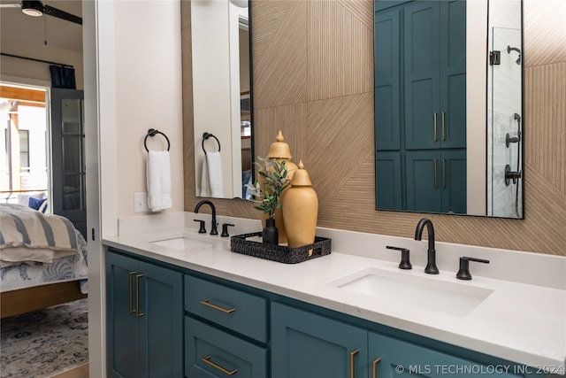 bathroom with ceiling fan and vanity