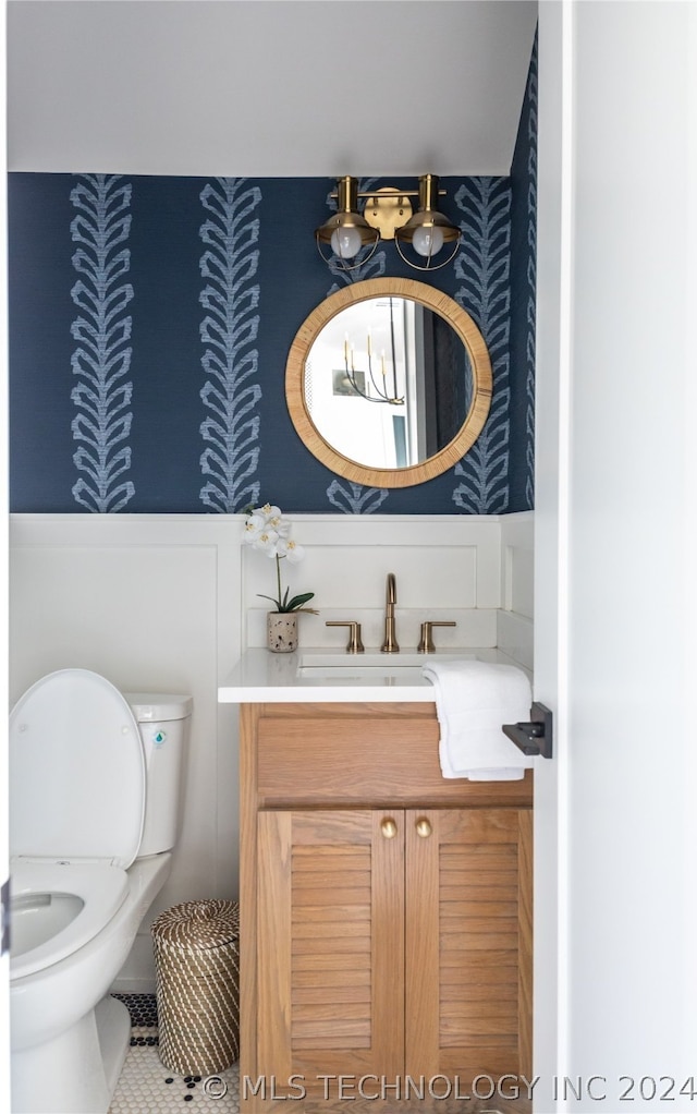 bathroom with vanity, tile patterned floors, and toilet