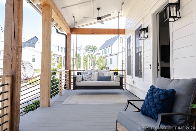 sunroom featuring ceiling fan, lofted ceiling, and a wealth of natural light