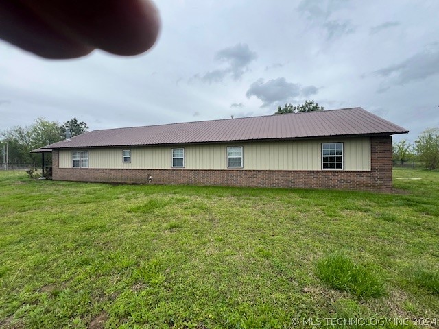 view of home's exterior with a lawn