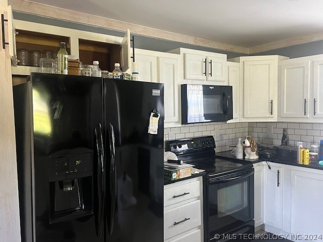 kitchen with backsplash, white cabinetry, and black appliances