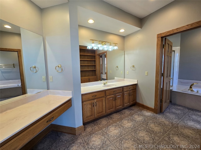 bathroom with vanity, a washtub, and tile flooring