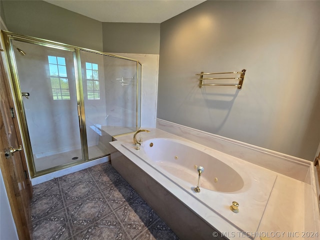 bathroom featuring tile flooring and plus walk in shower