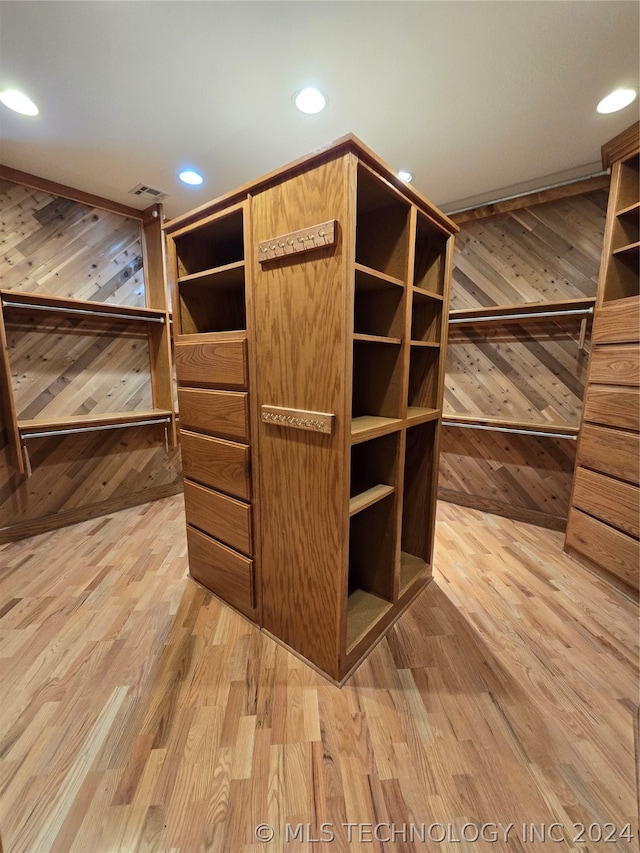 spacious closet with light hardwood / wood-style floors