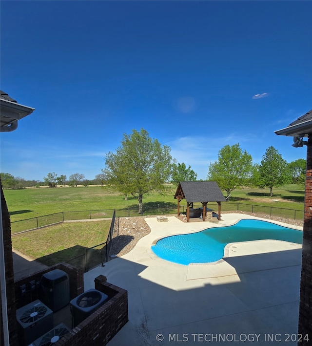 view of swimming pool with a patio, a yard, and a gazebo