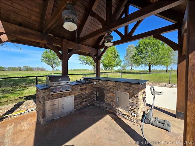 view of patio / terrace with a grill, exterior kitchen, and a gazebo