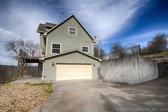 view of side of property featuring a garage