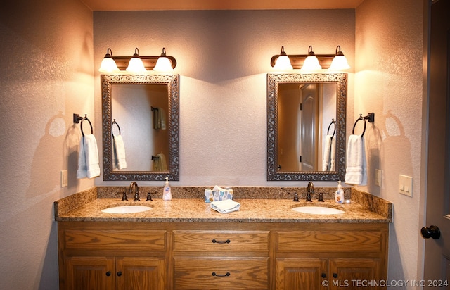 bathroom with dual bowl vanity