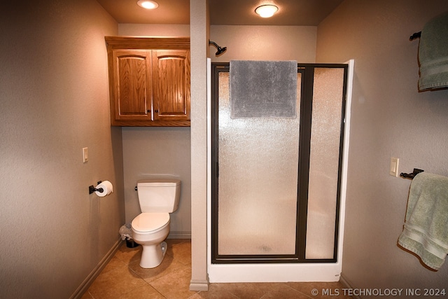 bathroom with tile floors, an enclosed shower, and toilet