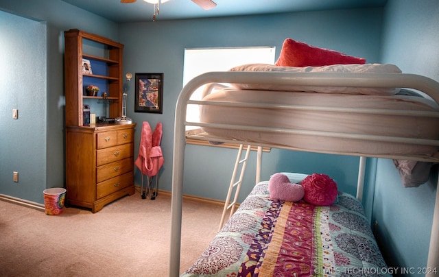 bedroom featuring light colored carpet and ceiling fan