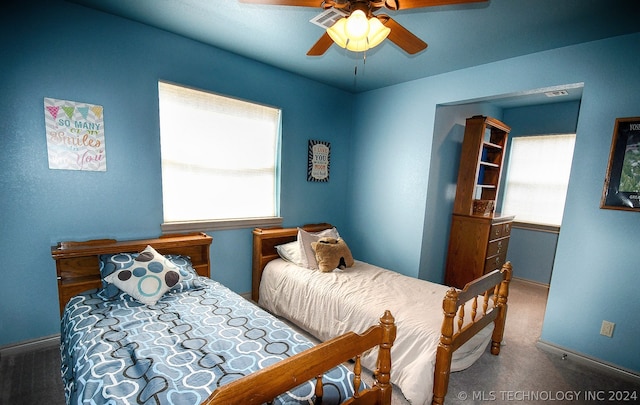 carpeted bedroom featuring ceiling fan