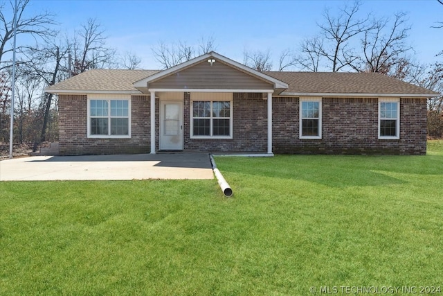 single story home with a patio area and a front yard