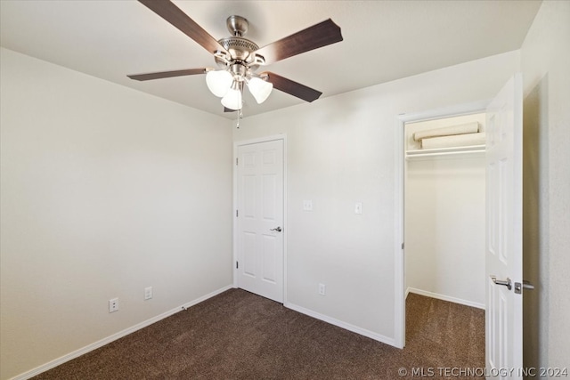 unfurnished bedroom featuring a closet, ceiling fan, and dark carpet