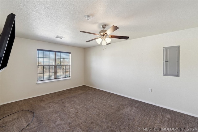 empty room featuring ceiling fan, carpet flooring, and a textured ceiling