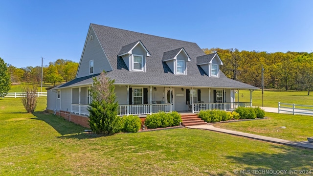 view of front of house with a front yard and a porch