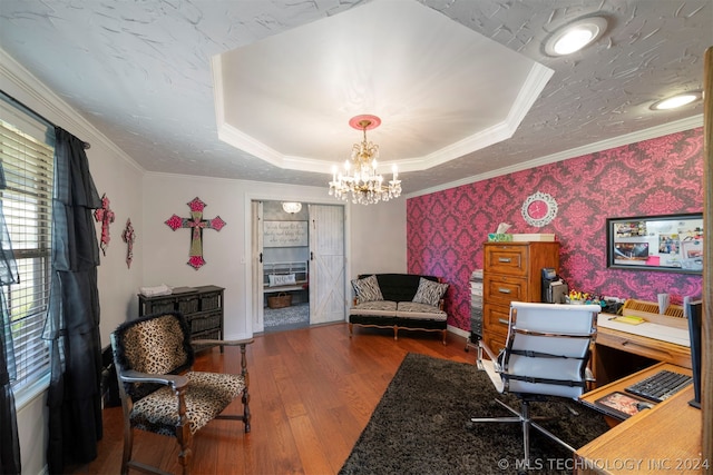 office area featuring ornamental molding, dark hardwood / wood-style flooring, a raised ceiling, and a notable chandelier