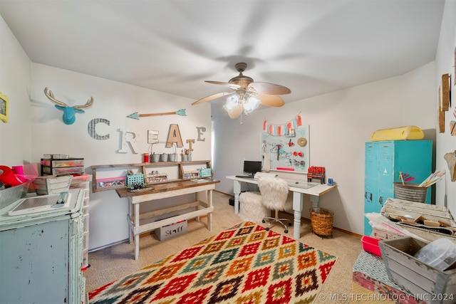 office area with light colored carpet and ceiling fan