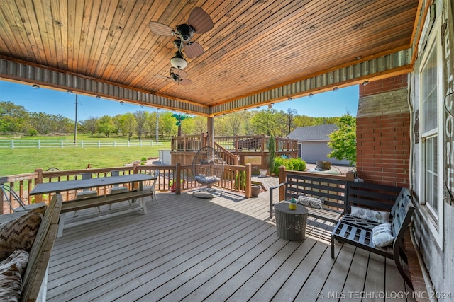 wooden deck featuring a yard