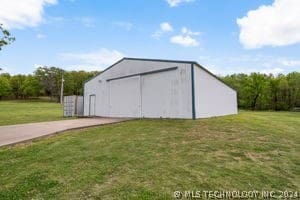 view of outdoor structure with a yard