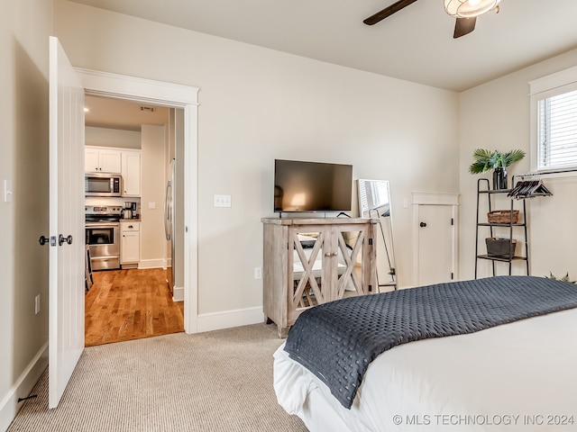 carpeted bedroom featuring ceiling fan