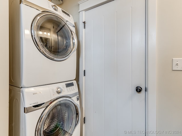 laundry room featuring stacked washer / dryer