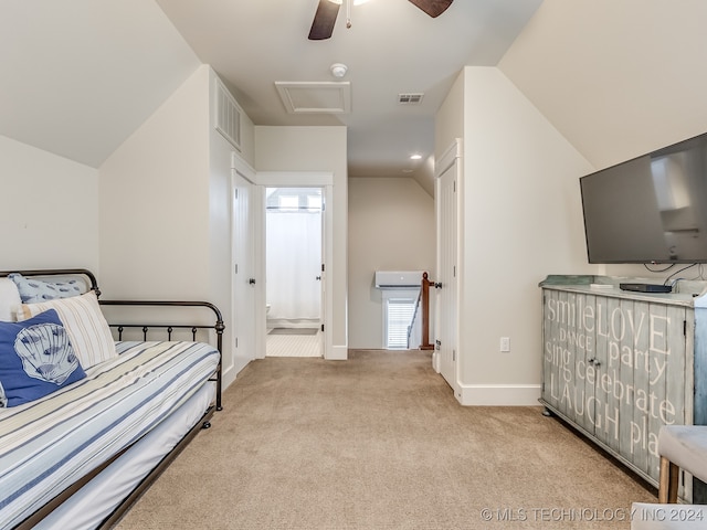 carpeted bedroom featuring multiple windows, ceiling fan, connected bathroom, and vaulted ceiling