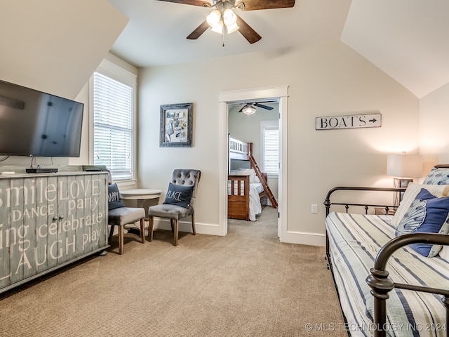 carpeted bedroom with ceiling fan and vaulted ceiling