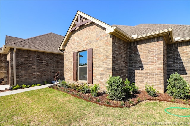 view of property exterior featuring a yard