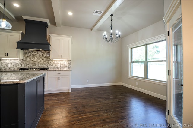 kitchen featuring decorative light fixtures, custom exhaust hood, and white cabinets