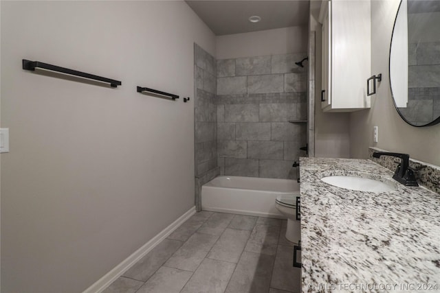 full bathroom with vanity, toilet, and tiled shower / bath